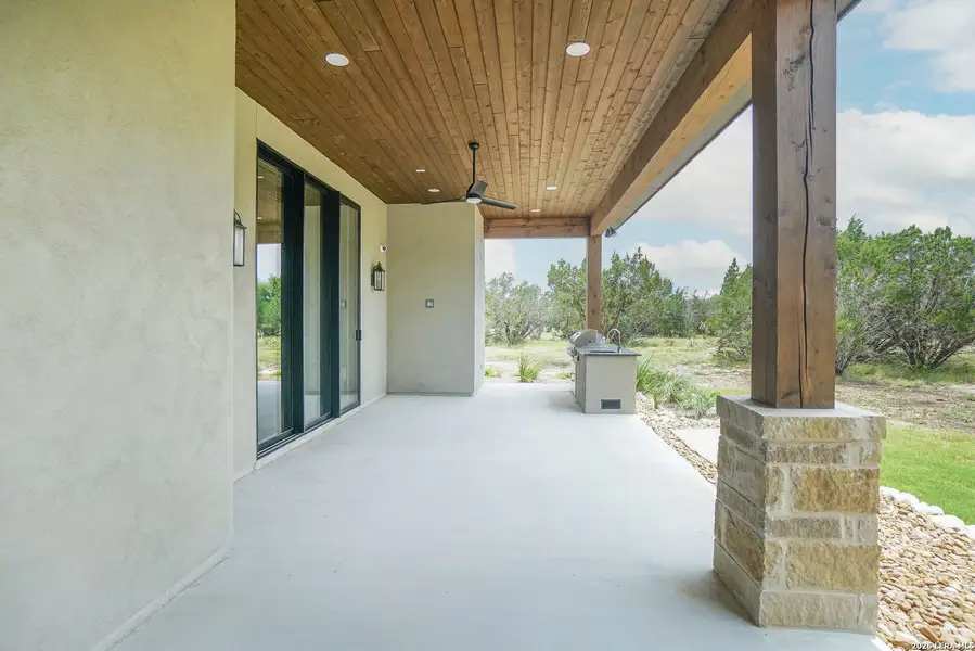 Exterior details and patio area of a home in , Spring Branch (Image 4). Exterior details and patio area of a home in , Spring Branch (Image 4).