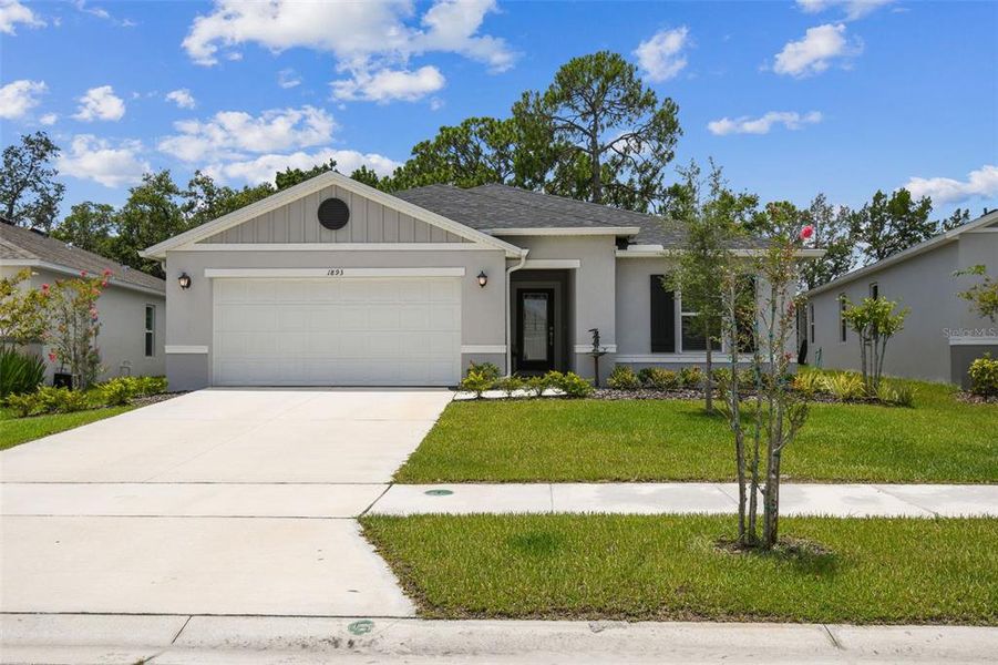 Front exterior of a new home in , Titusville, FL, highlighting curb appeal (Image 25).