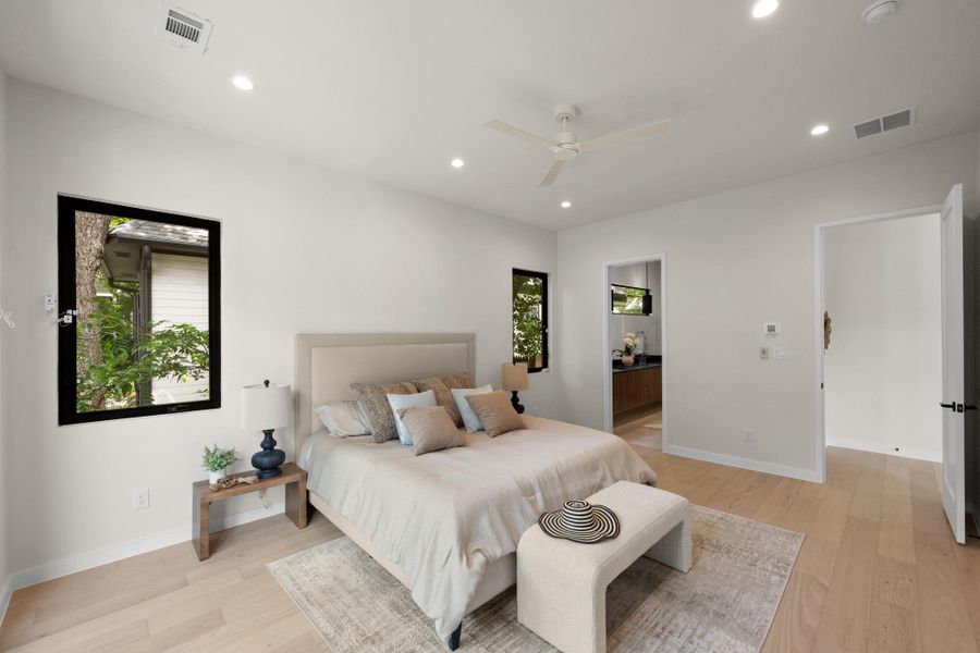 Hardwood floors and generous natural illumination complement this inviting primary bedroom retreat. Hardwood floors and generous natural illumination complement this inviting primary bedroom retreat.