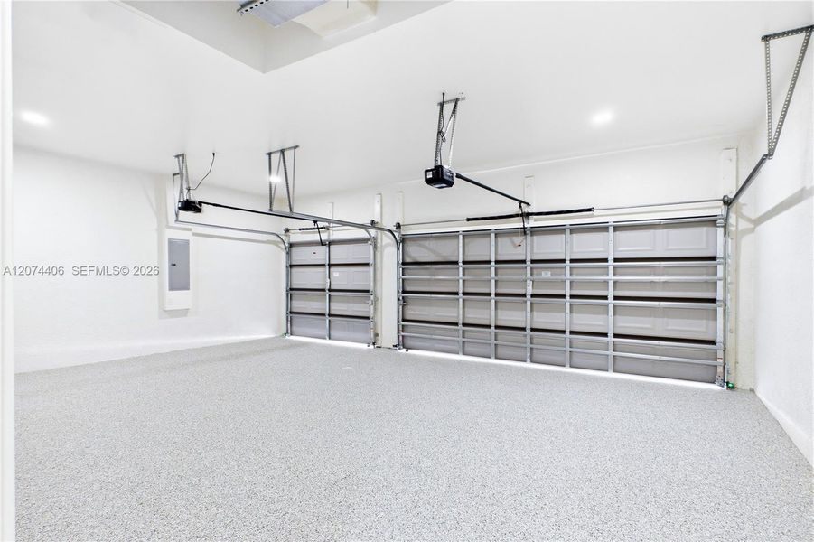 SPACIOUS 3-CAR GARAGE w/ durable EPOXY FLOORING offers plenty of room for vehicles, storage, bikes, water toys & all your SWFL LIFESTYLE essentials! SPACIOUS 3-CAR GARAGE w/ durable EPOXY FLOORING offers plenty of room for vehicles, storage, bikes, water toys & all your SWFL LIFESTYLE essentials!