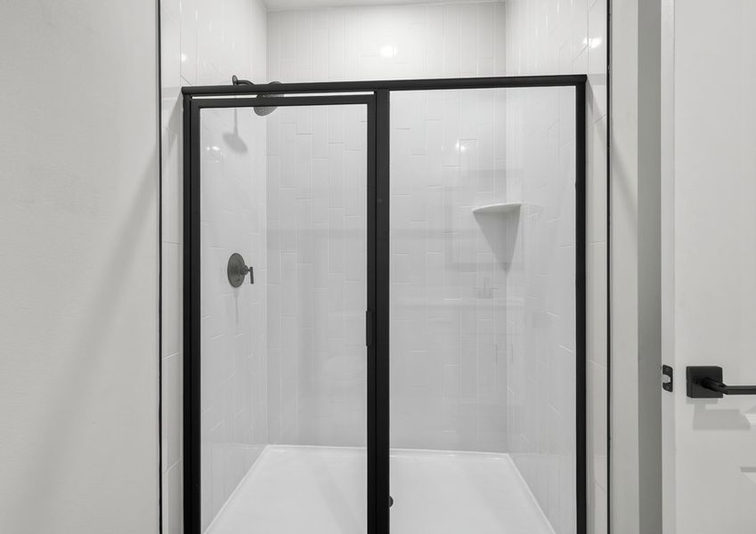 Step-in shower with tile detail in the master bathroom