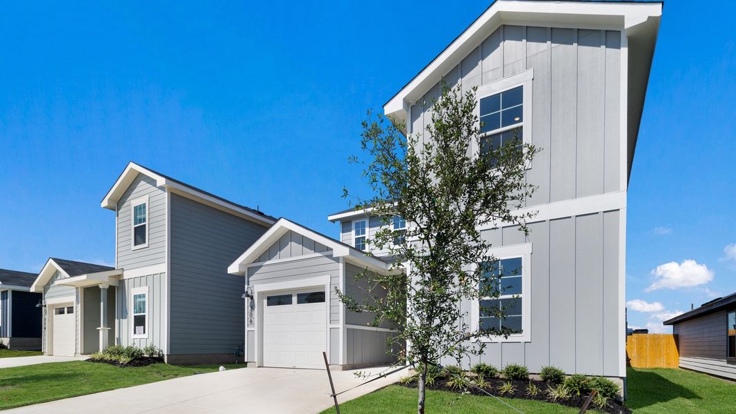 Representative exterior photo of a completed home built from the The Periwinkle by D.R. Horton in Marigold, Kyle, TX (Image 14). Representative exterior photo of a completed home built from the The Periwinkle by D.R. Horton in Marigold, Kyle, TX (Image 14).