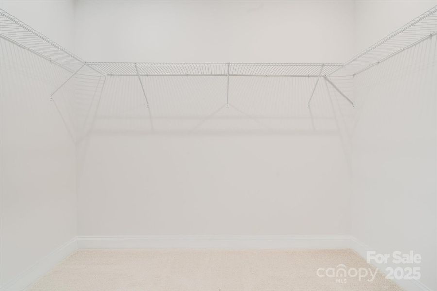 Primary Walk-in Closet Primary Walk-in Closet