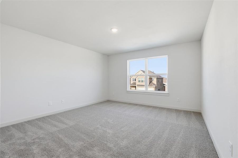 Empty room featuring carpet Empty room featuring carpet