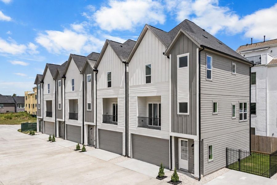 The exterior strikes a balance between modern design and timeless appeal. Layered textures, strong rooflines, and carefully considered proportions create a home that feels both distinctive and approachable.