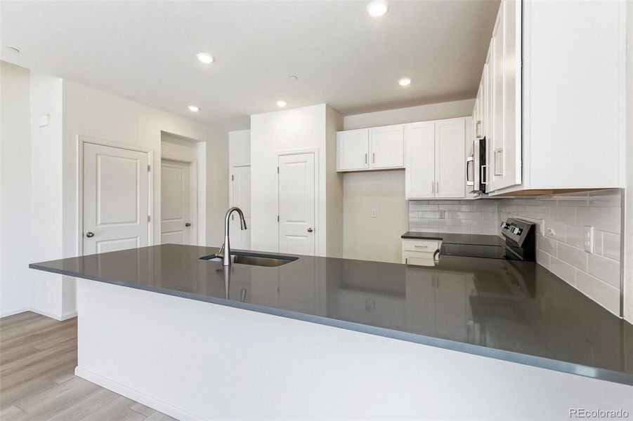 Furnished interior view inside a new home in Turnberry, Commerce City (Image 9).
