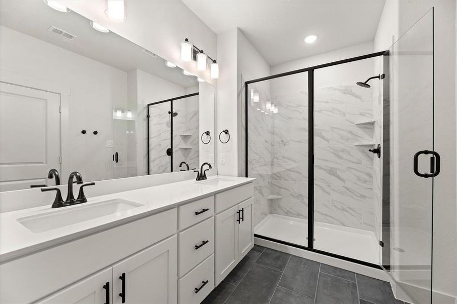 You'll find a lovely, spacious walk in shower in this dream owner's bath!