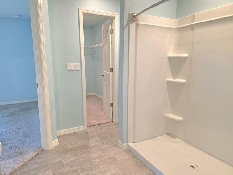Ensuite Shower with View into Large Walk-in Closet