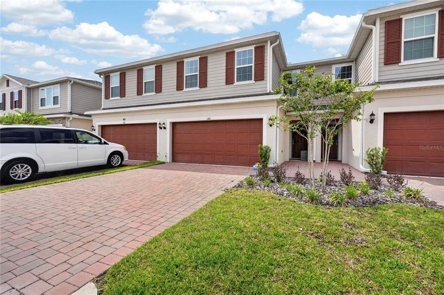 Front exterior of a new home in , Kissimmee, FL, highlighting curb appeal (Image 24).