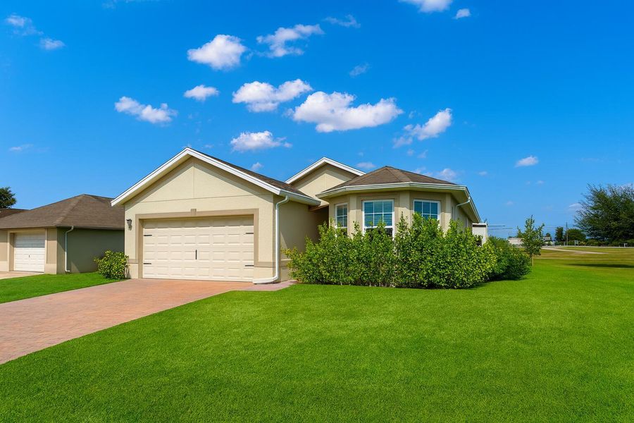 Front exterior of a new home in , Cape Coral, FL, highlighting curb appeal (Image 2). Front exterior of a new home in , Cape Coral, FL, highlighting curb appeal (Image 2).