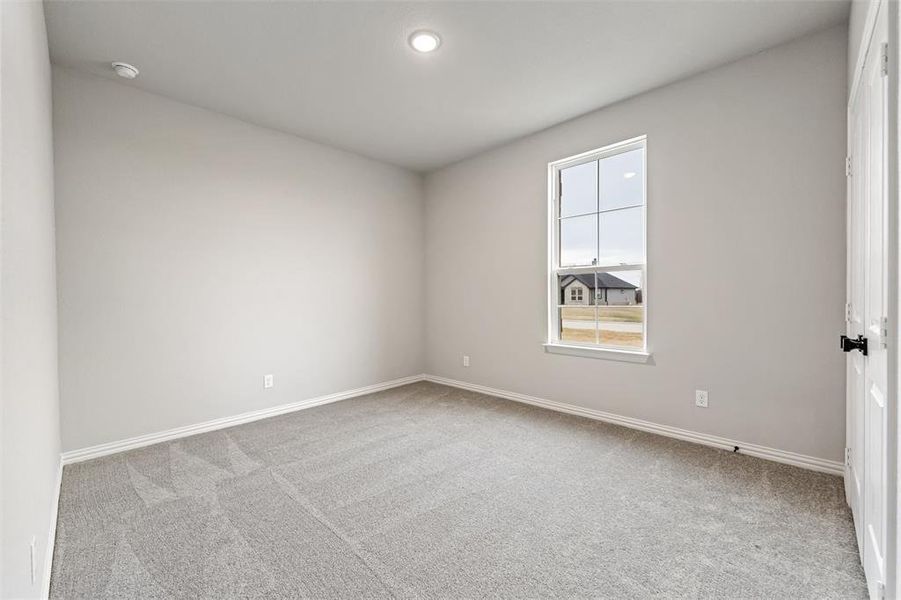 Empty room featuring light carpet and recessed lighting Empty room featuring light carpet and recessed lighting