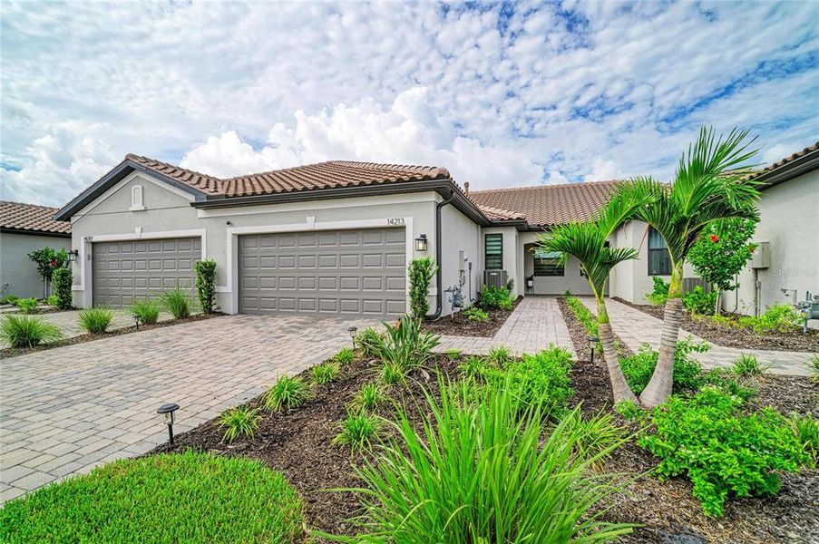 Front exterior of a new home in , Nokomis, FL, highlighting curb appeal (Image 1). Front exterior of a new home in , Nokomis, FL, highlighting curb appeal (Image 1).