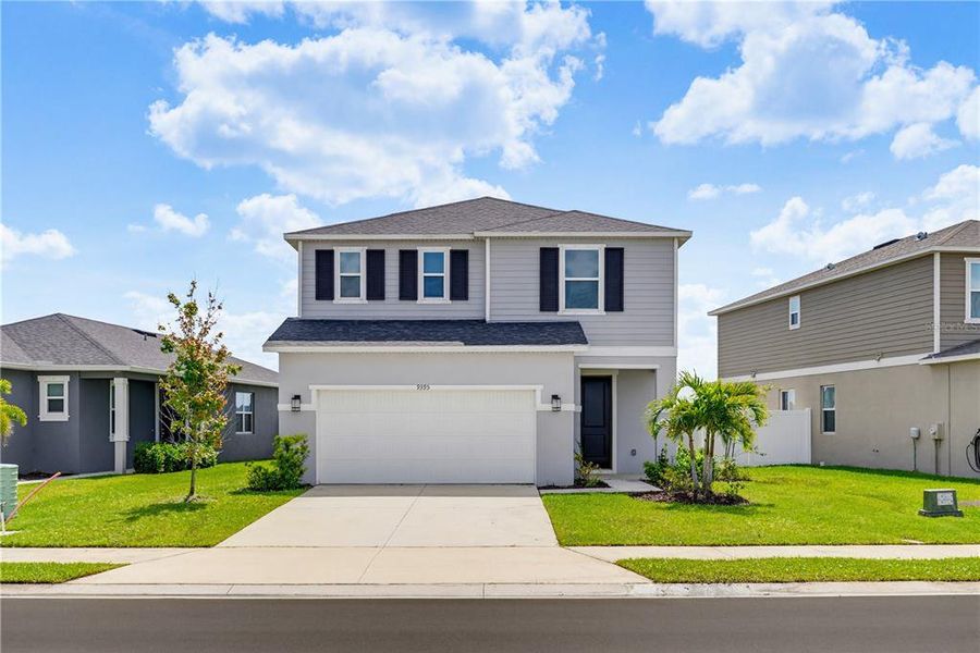 Front exterior of a new home in , Parrish, FL, highlighting curb appeal (Image 25).