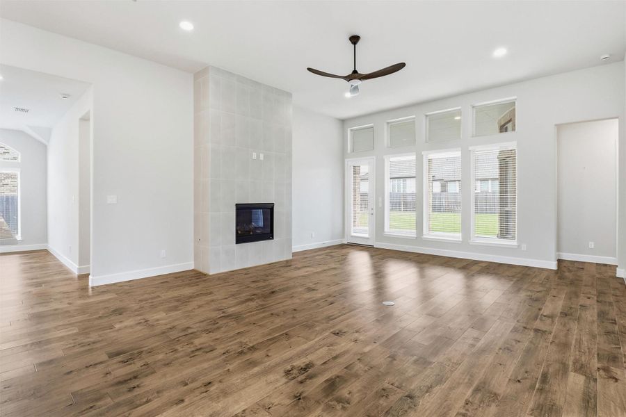 Huge living area with fireplace, plus views and access to extended covered back patio.