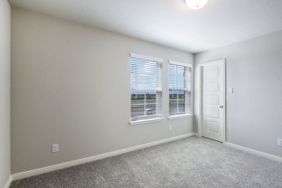 Guest bedroom in the Medina floorplan at a Meritage Homes community.