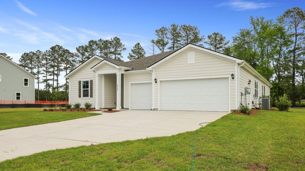 Front exterior of a new home in Berkeley Bay, Ridgeville, SC, highlighting curb appeal (Image 23).
