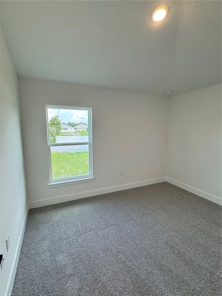 Spacious, unfurnished interior of a new home in Watercress Cove, North Port (Image 10).