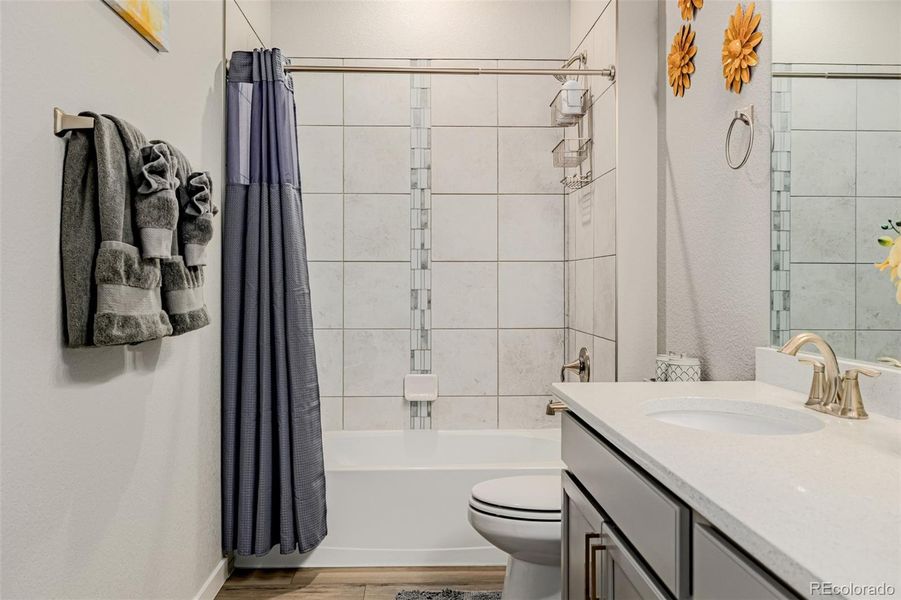 Second Bathroom with tub/shower combo, quartz counters and tile accents Second Bathroom with tub/shower combo, quartz counters and tile accents