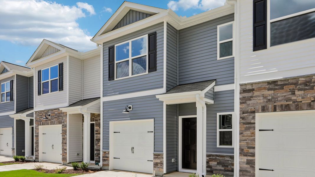 Front exterior of a new home in The Townes at Martin Farms, Aberdeen, NC, highlighting curb appeal (Image 15). Front exterior of a new home in The Townes at Martin Farms, Aberdeen, NC, highlighting curb appeal (Image 15).