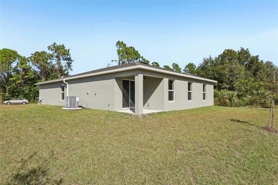 Exterior details and patio area of a home in Palm Bay Classic, Palm Bay (Image 10).