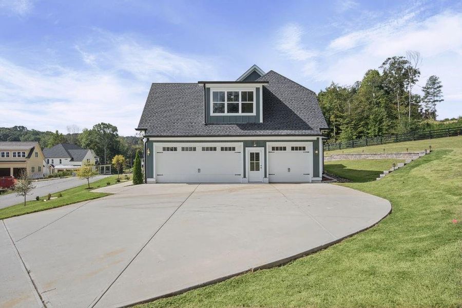Front exterior of a new home in , Dacula, GA, highlighting curb appeal (Image 1). Front exterior of a new home in , Dacula, GA, highlighting curb appeal (Image 1).