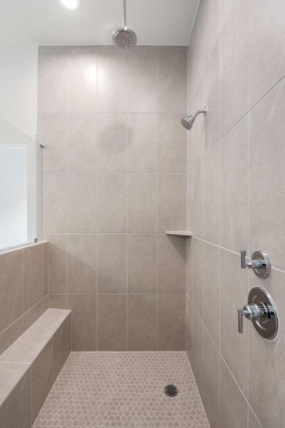 Full bath with a tile shower