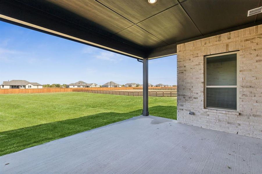 Fenced backyard featuring a patio area