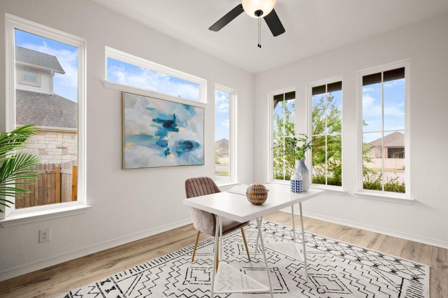 French doors off the foyer open into this beautiful home office, wrapped in generous windows with front yard views. French doors off the foyer open into this beautiful home office, wrapped in generous windows with front yard views.