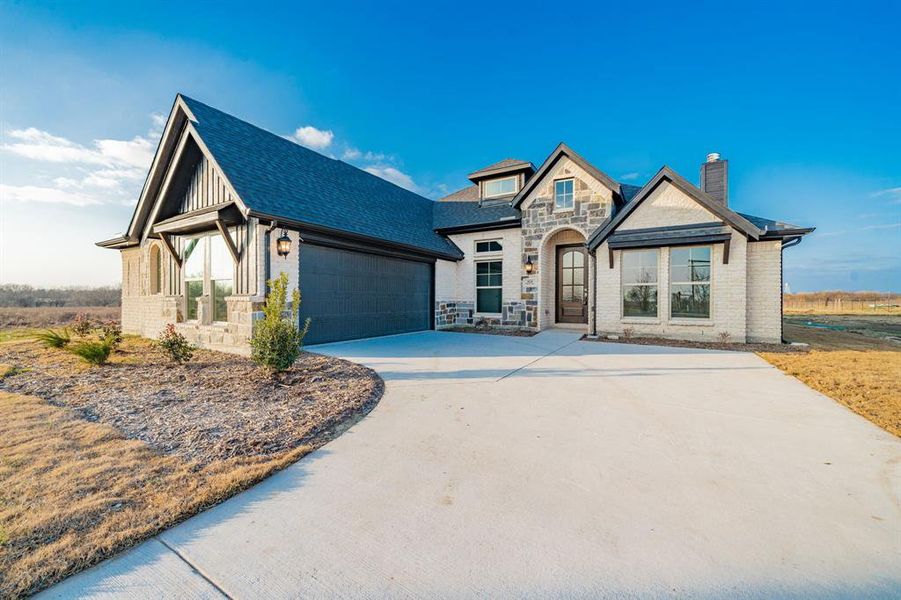 Front exterior of a new home in , Celeste, TX, highlighting curb appeal (Image 24).