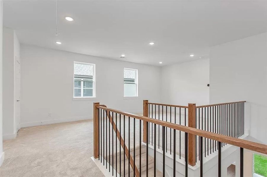 Hallway with light carpet