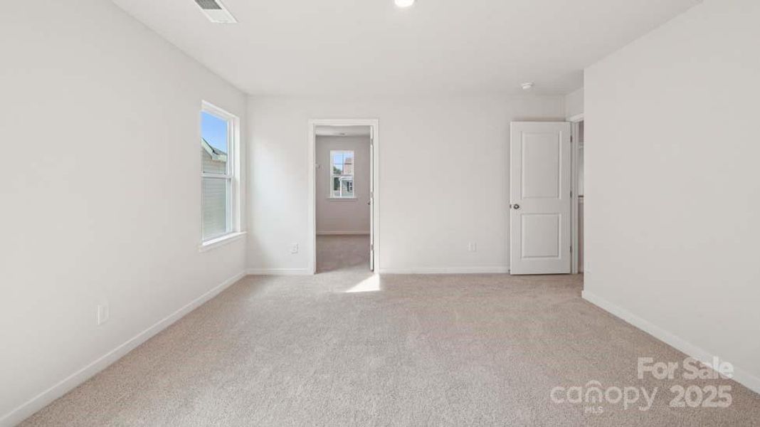 Spacious, unfurnished interior of a new home in Cardinal Creek, Charlotte (Image 24).
