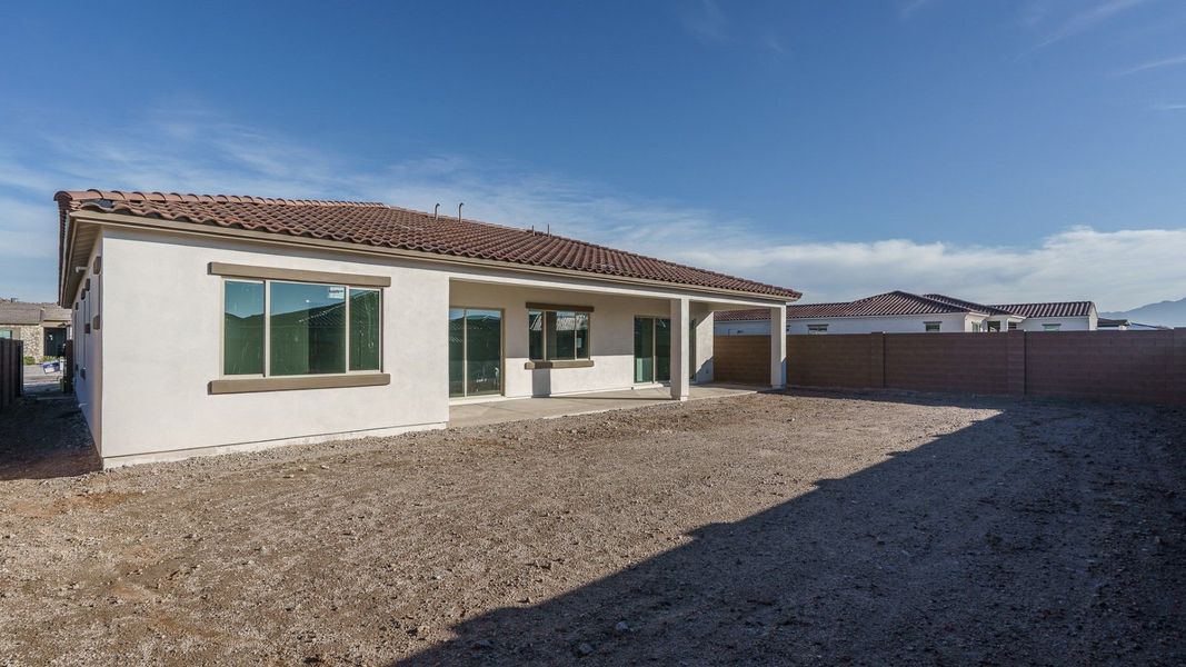 Exterior details and patio area of a home in Harmony at Montecito in Estrella, Goodyear (Image 3). Exterior details and patio area of a home in Harmony at Montecito in Estrella, Goodyear (Image 3).