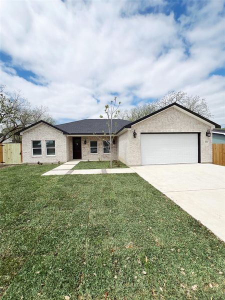 Ranch-style home featuring roof with shingles, a front lawn, driveway, fence, and a garage Ranch-style home featuring roof with shingles, a front lawn, driveway, fence, and a garage