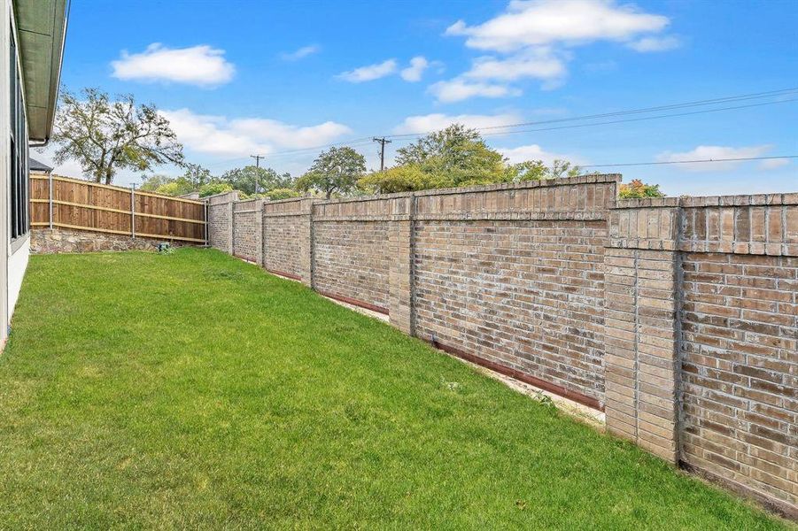 View of fenced backyard
