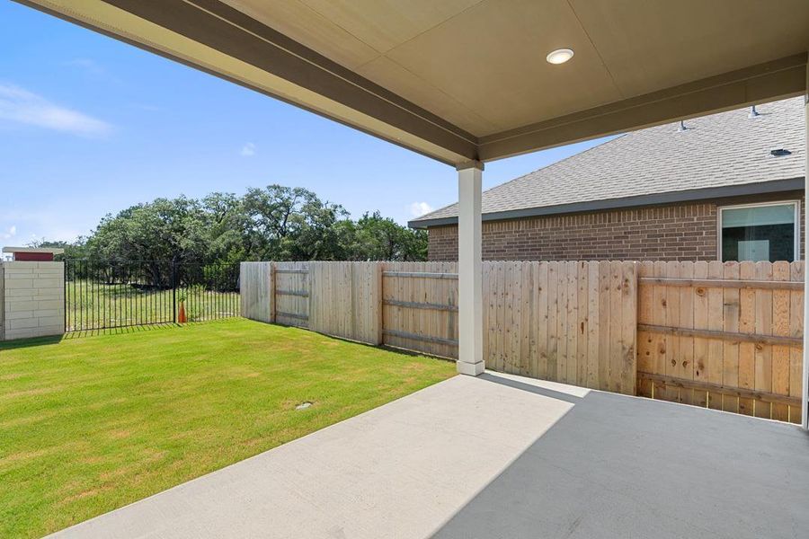 Exterior details and patio area of a home in Terrace Collection at Lariat, Liberty Hill (Image 2). Exterior details and patio area of a home in Terrace Collection at Lariat, Liberty Hill (Image 2).
