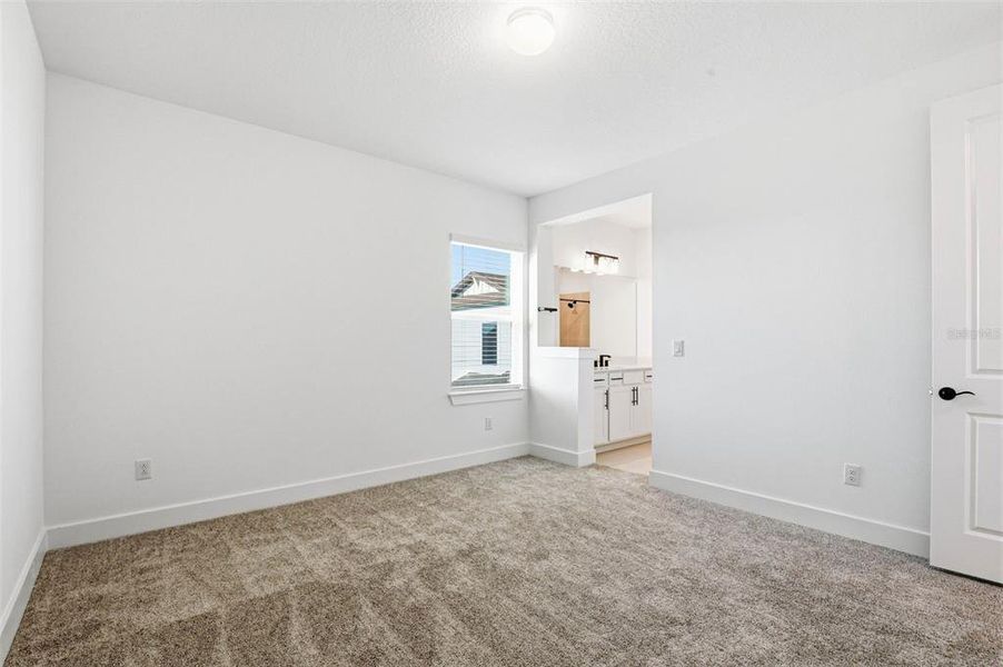 Spacious, unfurnished interior of a new home in Vida's Way, Wesley Chapel (Image 56).