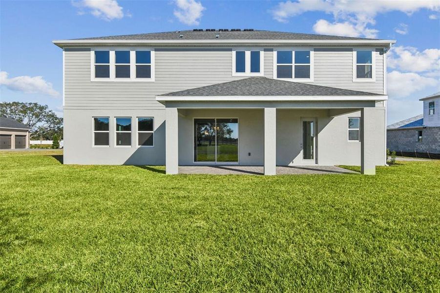 Exterior details and patio area of a home in Solace at Corner Lake, Orlando (Image 3). Exterior details and patio area of a home in Solace at Corner Lake, Orlando (Image 3).