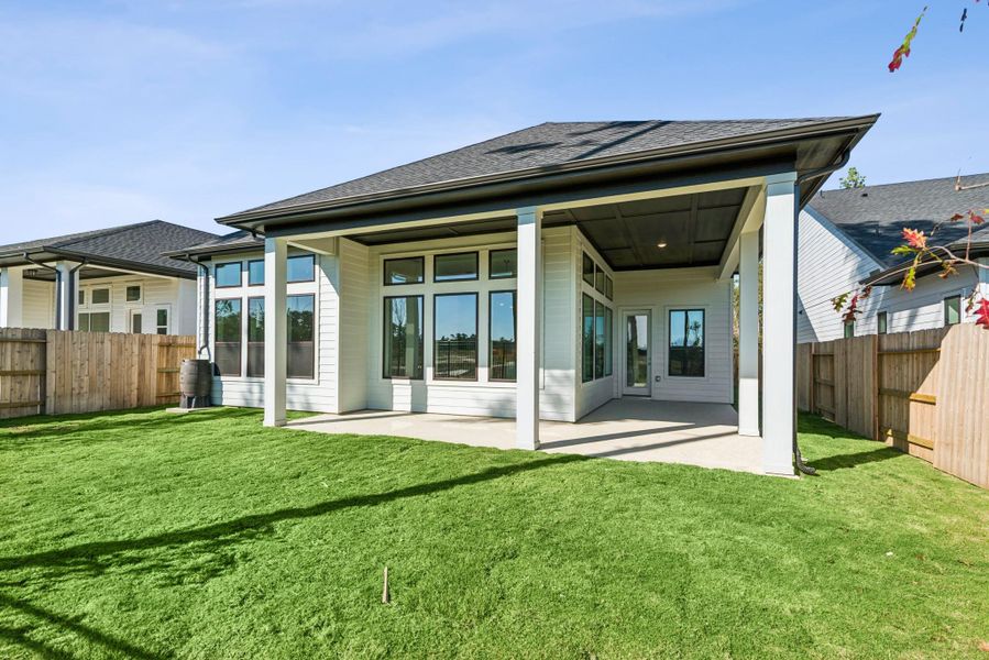 Exterior details and patio area of a home in ARTAVIA 50' Homesites, Conroe (Image 26).