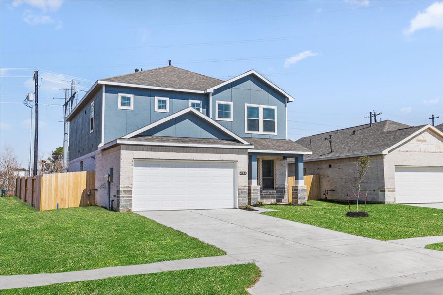 Front exterior of a new home in Kendall Lakes, Alvin, TX, highlighting curb appeal (Image 2).