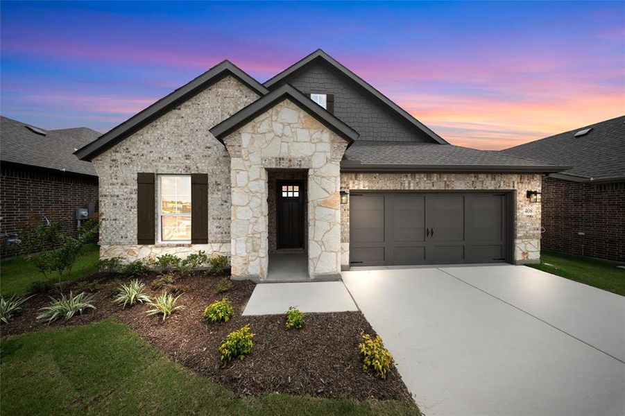 View of front facade with an attached garage, driveway, stone siding, brick siding, and a shingled roof