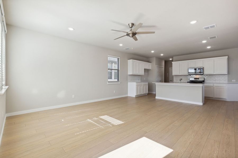 Living room in the Oak home plan by Trophy Signature Homes – REPRESENTATIVE PHOTO