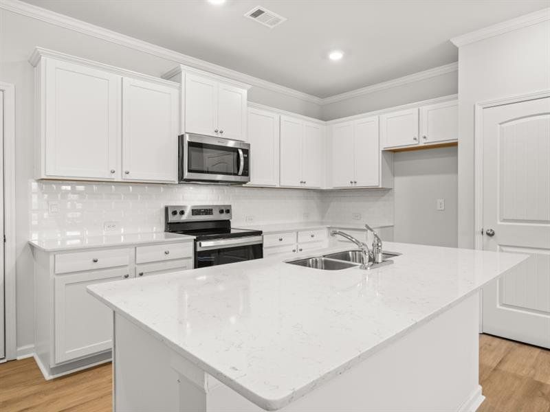 Furnished interior view inside a new home in Waypoint, Flowery Branch (Image 8).
