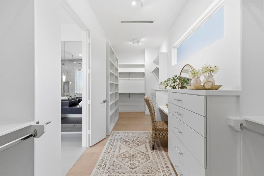This photo features a completed closet with dressing vanity from a completed Niche Homes build. This photo features a completed closet with dressing vanity from a completed Niche Homes build.