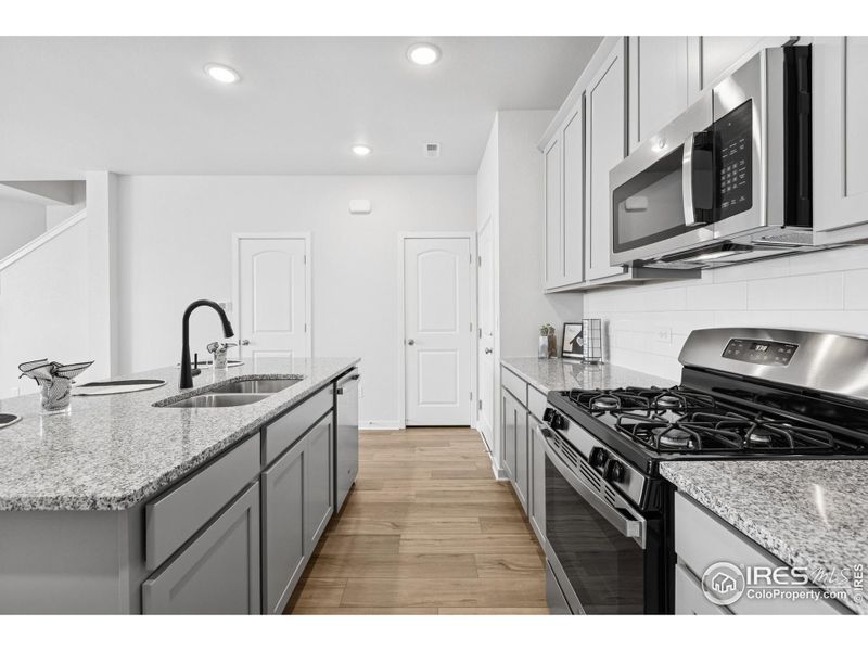 Furnished interior view inside a new home in Kinston Mainstreet Townhomes, Loveland (Image 14). Furnished interior view inside a new home in Kinston Mainstreet Townhomes, Loveland (Image 14).