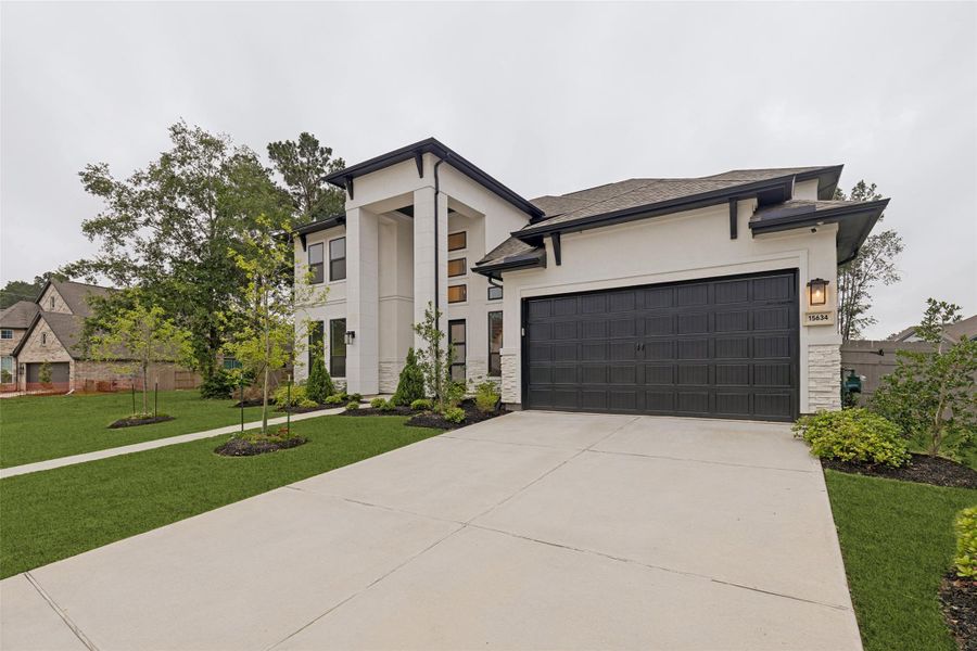 Front exterior of a new home in , Conroe, TX, highlighting curb appeal (Image 27).