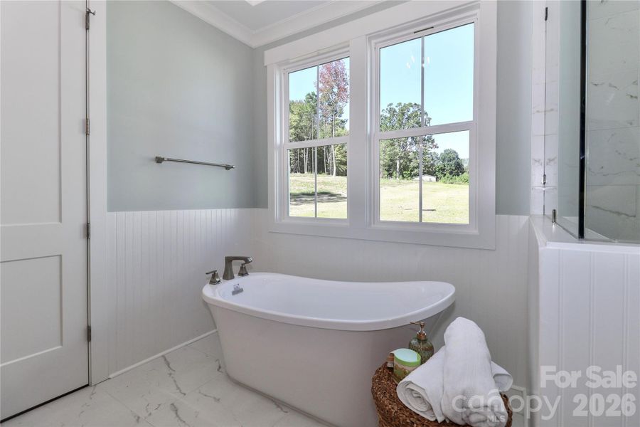 The primary bathroom is all about luxury and relaxation. The primary bathroom is all about luxury and relaxation.