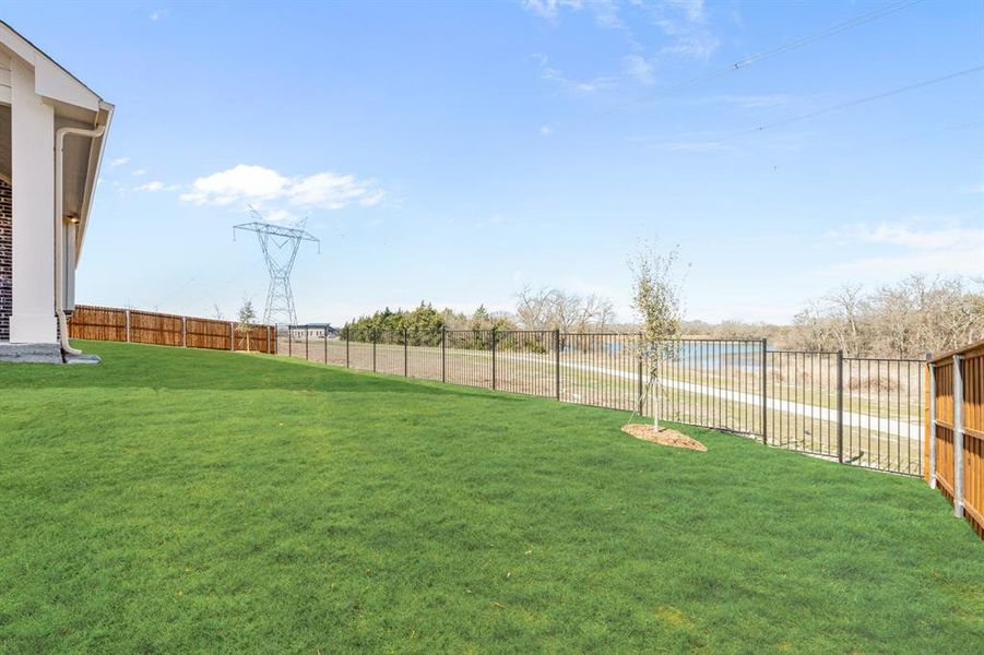 Exterior details and patio area of a home in Villages of Hurricane Creek, Anna (Image 28).
