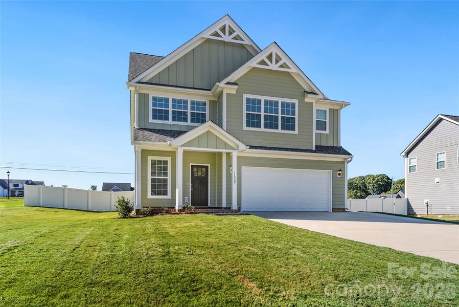 Front exterior of a new home in , Stanfield, NC, highlighting curb appeal (Image 28).