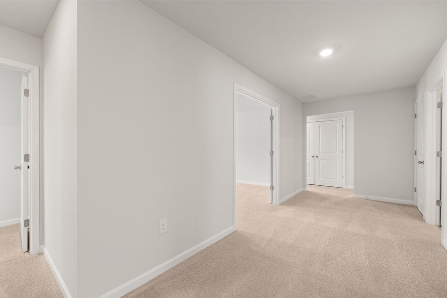 Representative unfurnished interior of a home built from the Mansfield by D.R. Horton in Southwind Village, Evans (Image 30).