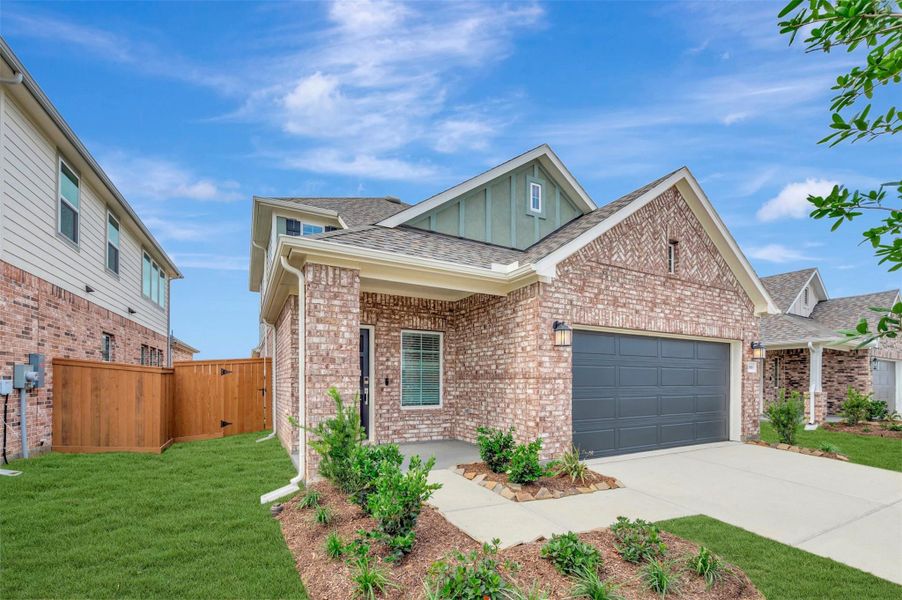Front exterior of a new home in Wildrye, Waller, TX, highlighting curb appeal (Image 16).
